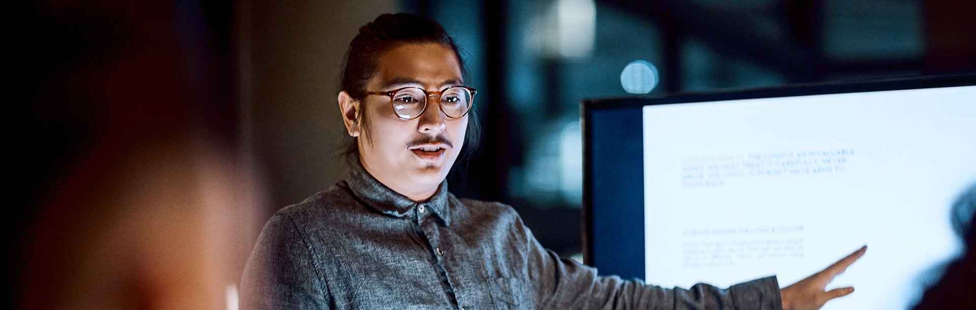 Man pointing to TV screen